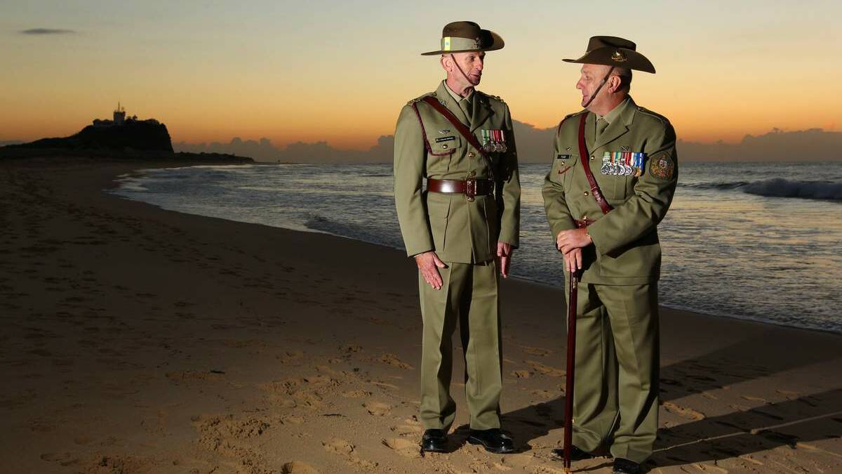 Lieutenant Colonel Edward McCain and Warrant Officer class 1 Paul Fuge at the 2013 Nobbys Beach Anzac Day dawn service.