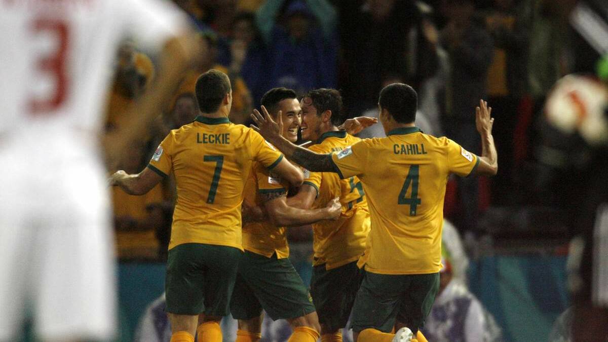 The Socceroos celebrate their win on Tuesday night.