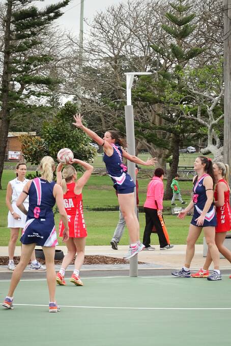 Maryville Tavern and Souths Leagues Netball Club players battle it out on-court.