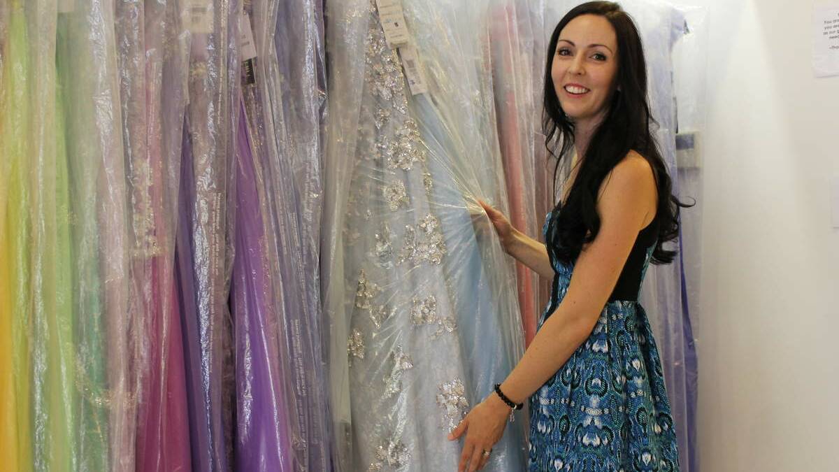 Field of Dreams charity founder Bianca Judd searches for the perfect dress at Gorgeous Gowns, Charlestown, a sponsor of the Pinstripe & Pearl Benefit Ball.