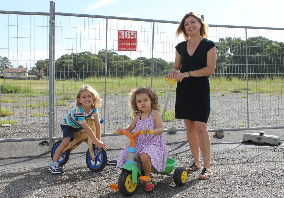 UNFAIR: Whitebridge mother Laurie Mascord with her children Noah, 4, and Molly, 2 at the proposed development site which includes a private park.