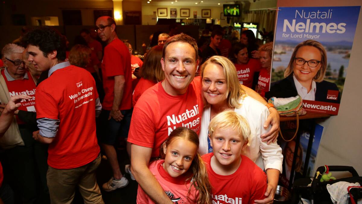 Labor lord mayor Nuatali Nelmes with her husband Stuart and their kids Stella and Archie at the Seven Seas hotel in Carrington where they claimed victory.