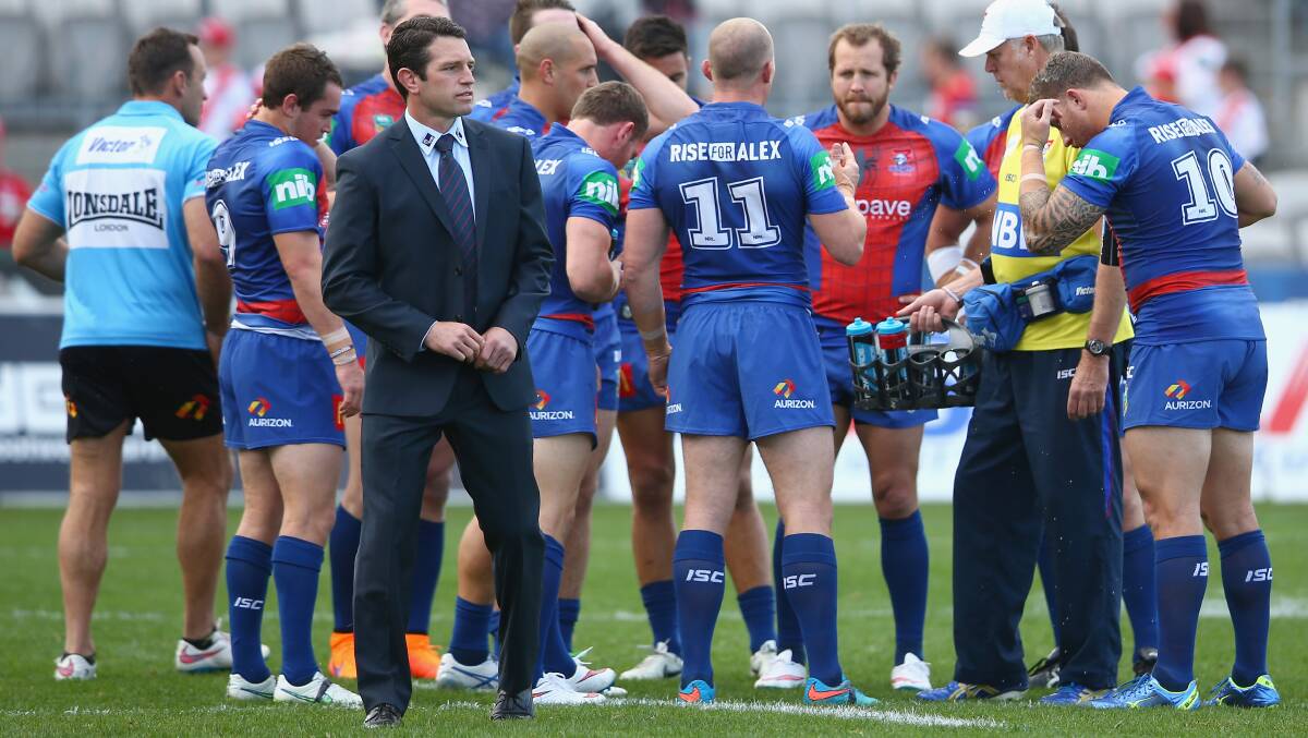 DEBUT DEFEAT: Danny Buderus watches on as the Knights warm up on Sunday.   Picture: Getty Images