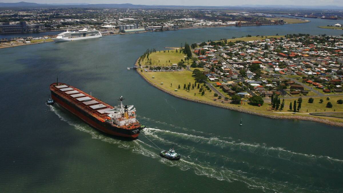 An aerial view of a coal vessel entering Newcastle Harbour.