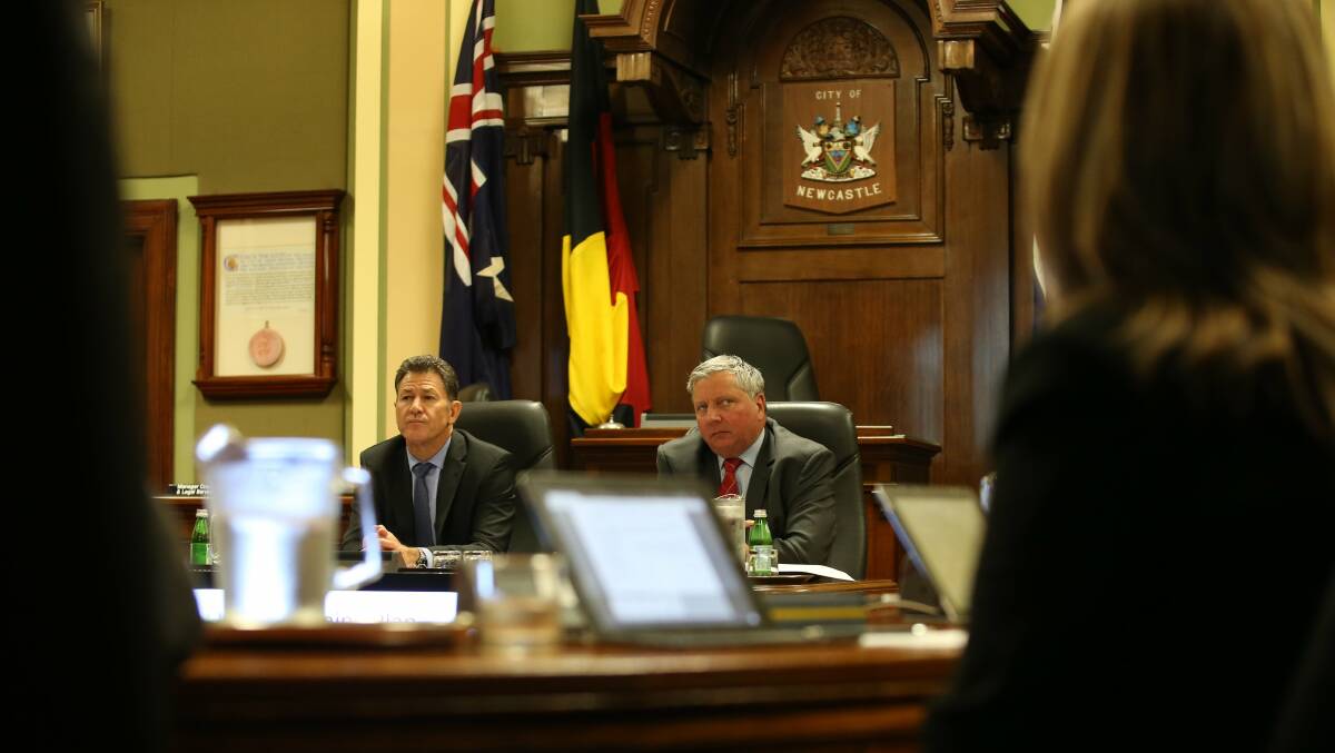 Newcastle City Council acting lord mayor Brad Luke, right, at last night’s public meeting, the first since the resignation of Jeff McCloy. Picture: Dean Osland