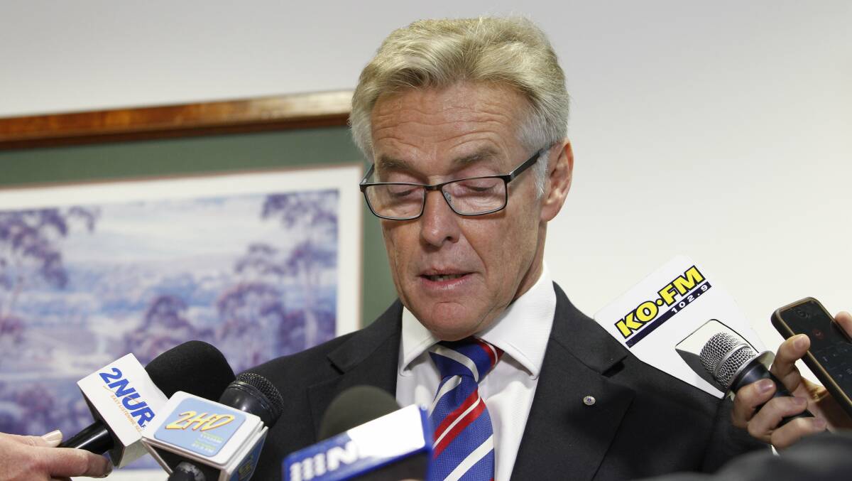 Newcastle MP Tim Owen reading a statement to media at a news conference in May  where he announced that he would not be contesting the next election due stating recurring health issues and recent Independent Commission Against Corruption (ICAC) revelations.