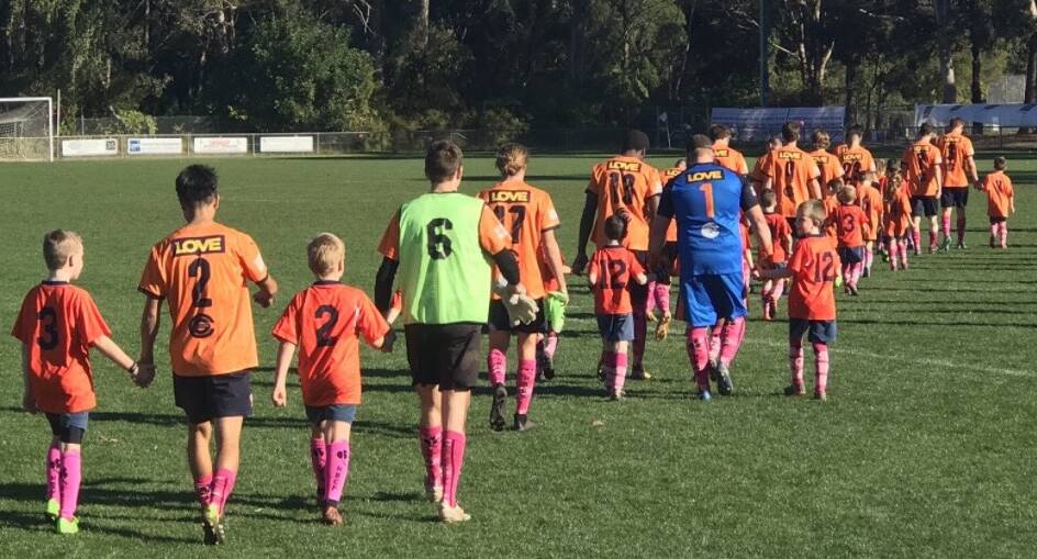 Football club goes pink with more than 800 coloured socks for HBCF.