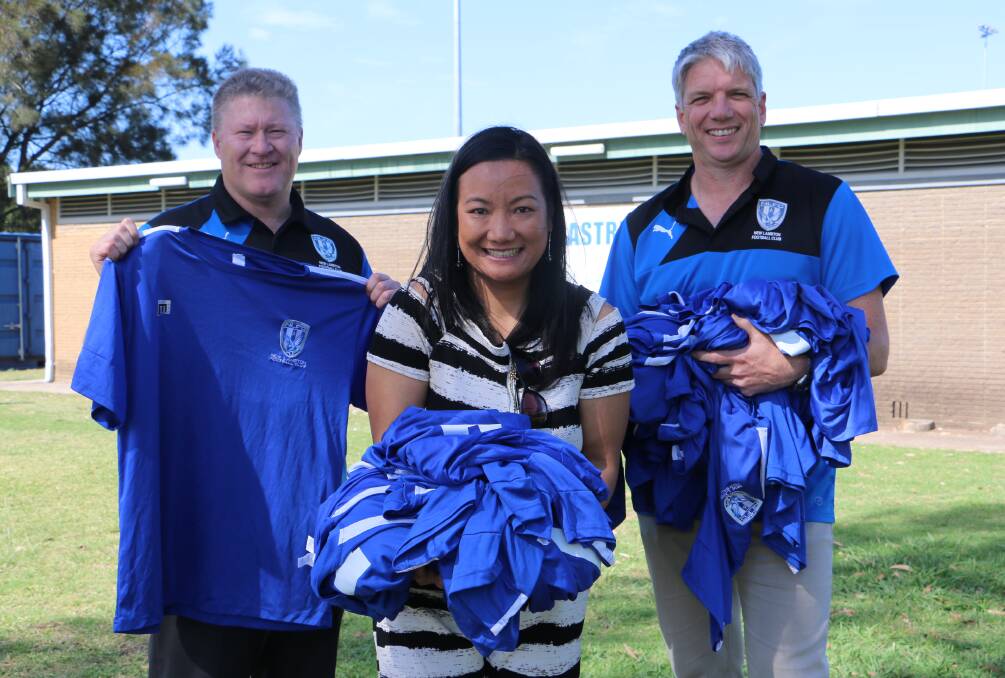 SHIRTS OFF THEIR BACKS: Steve Manning (New Lambton FC inter-district president), Donna Leach (FEAT vice-president), and Nic Mahony (New Lambton FC inter-district secretary) with the donated jerseys. Picture: Ellie-Marie Watts