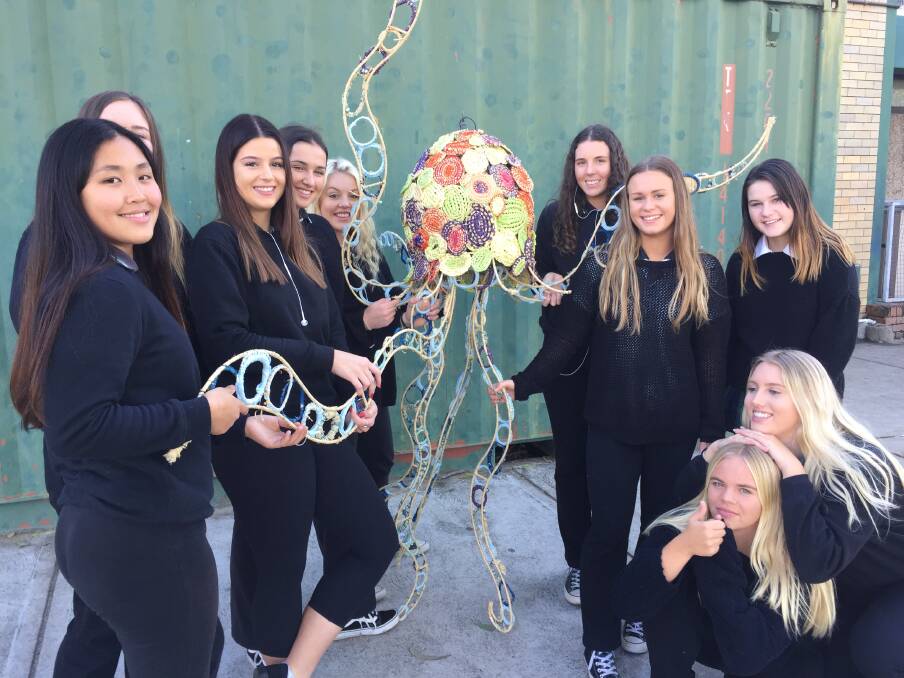 SCULPTURES: Warners Bay High School students show off their submission to Transmission. Picture supplied.