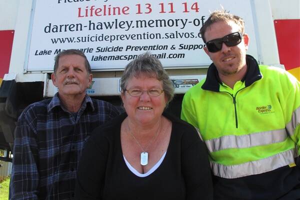 COPING WITH SUICIDE: Brian, Faye and Scott Hawley, in front of Scott's truck, which features a tribute to their son and brother Darren, who committed suicide in 2006.
