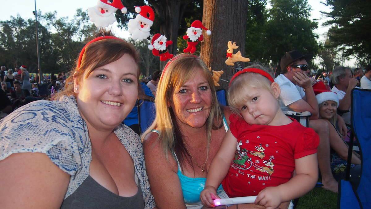 Hayley Rossington of Argenton with her mother Julie and daughter Aliyah McGowan, 2 at Newcastle Permanent annual Carols By Candlelight, Speers Point Park.