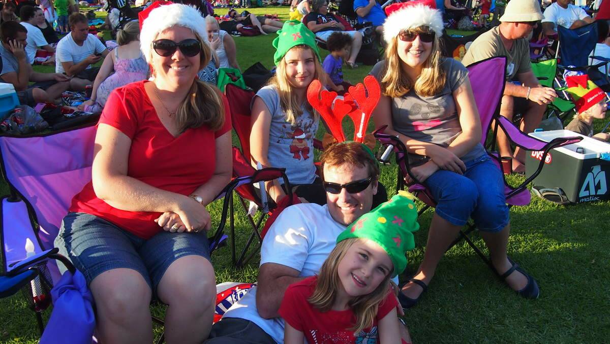 The Jenkins family - Lisa, Tara, 10, Zoe, 13, Dareen and Maya, 7 - of Elermore Vale at Newcastle Permanent annual Carols By Candlelight, Speers Point Park.