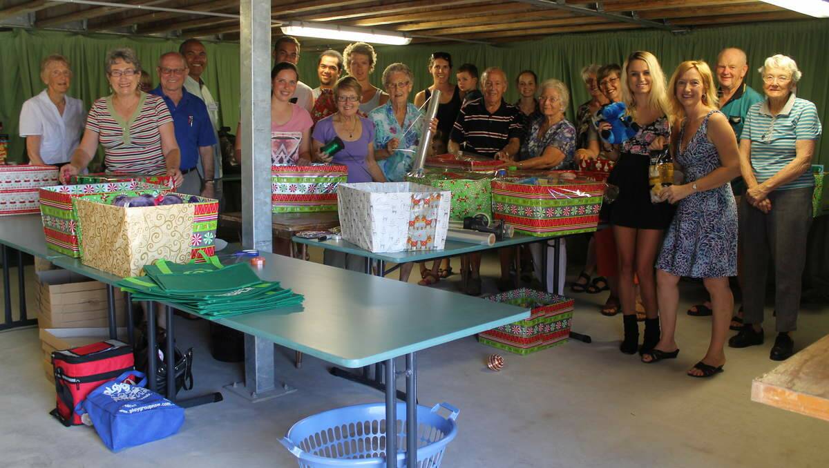 HELPERS: St Luke’s Uniting Church Community Commission volunteers pack hampers to distribute for Project Blessing.