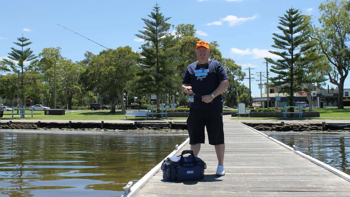 LIKELY LURE: Fishing Lake Macquarie's Tony Griffiths tries his luck off the jetty at The Esplanade, Warners Bay.