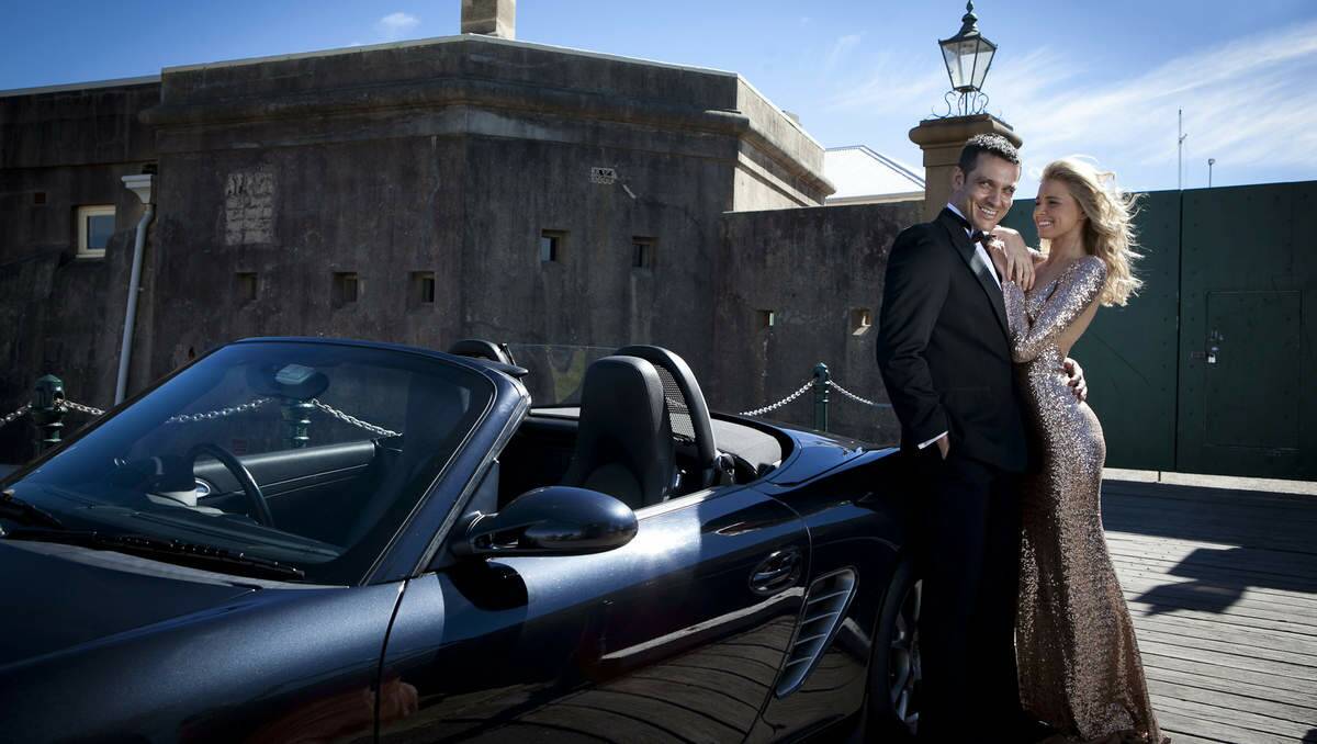 PARTY ROYALE: Models Tegan Martin and Dean Kyrwood pose at Fort Scratchley, dressed according to the James Bond theme for Get Fortified. Picture: Jacqui Clancy