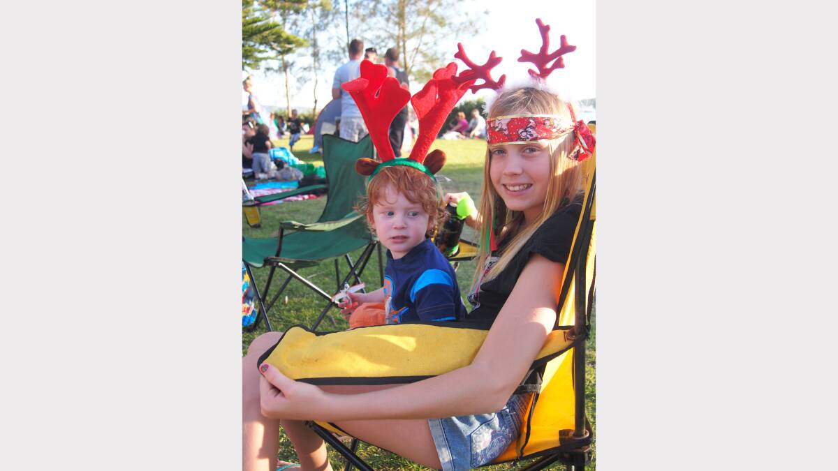 Harrison Bullen, 2, of Valentine with Riley McDonald, 10, of Eleebana at Newcastle Permanent annual Carols By Candlelight, Speers Point Park.