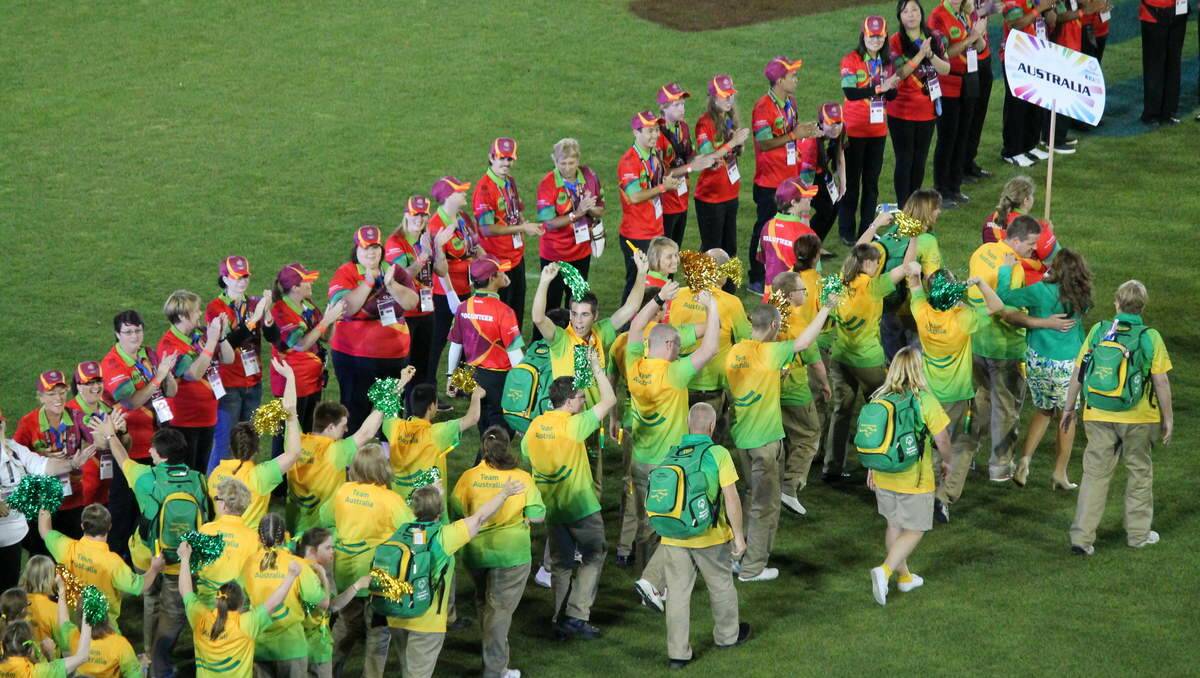 The Australian team parades onto the field.