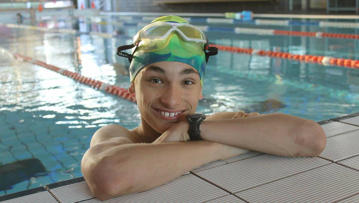 TALENTED: Lorcan Redmond in training for the swimming component of a triathlon.
