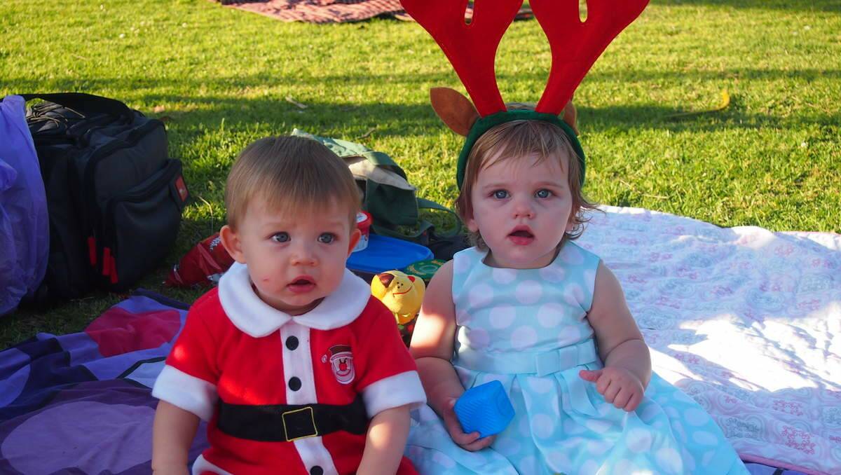 Archer Evans, 10 months, Maryland and Violet Langan, 11 months, Eleebana at Newcastle Permanent annual Carols By Candlelight, Speers Point Park.