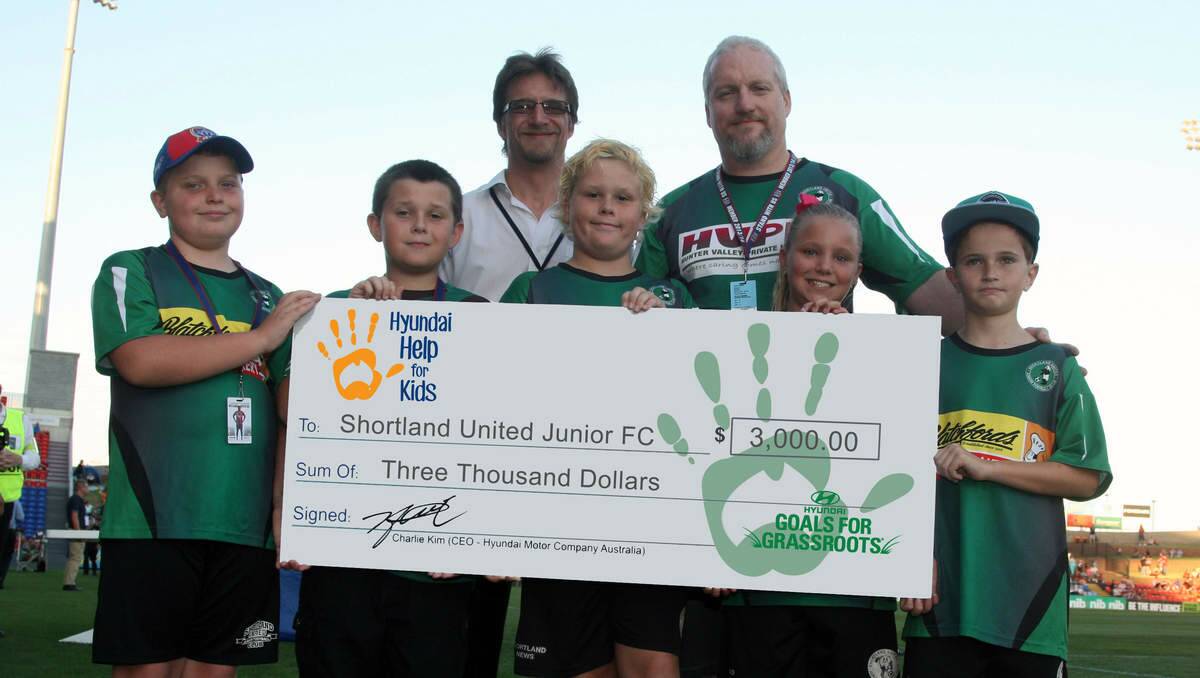 NETTED: Members of the Shortland United Junior Football Club hold a cheque for $3000 they received as winners of the Hyundai Goals for Grassroots grant.