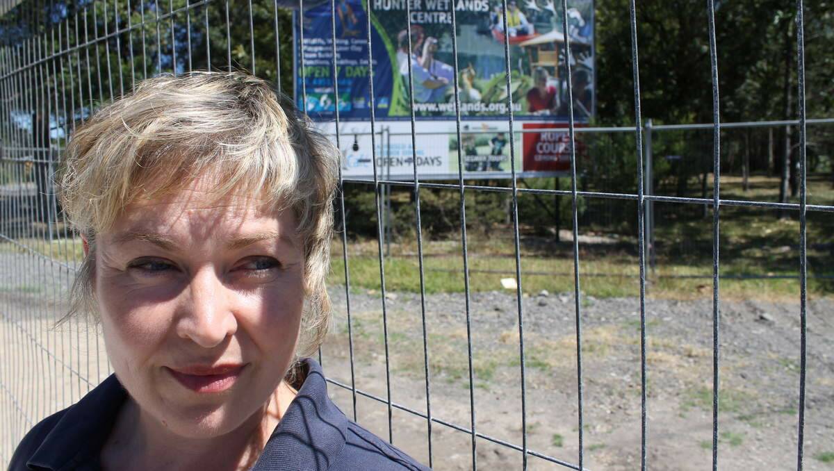 BYPASS BOTHER: Hunter Wetlands Centre ecotourism manager Anna Ryan stands by the roadworks fence outside the centre.
