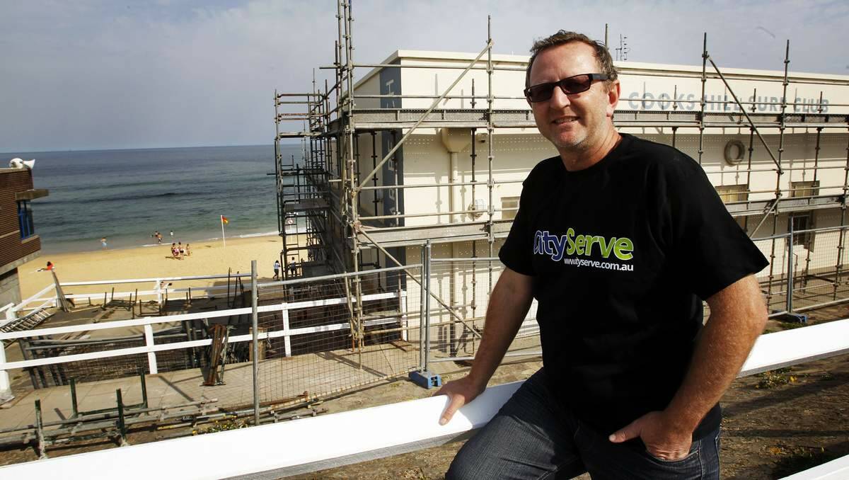 SERVICE: Newcastle Citizen of the Year Pastor Rick Prosser working with Cityserve at Cooks Hill Surf Club.