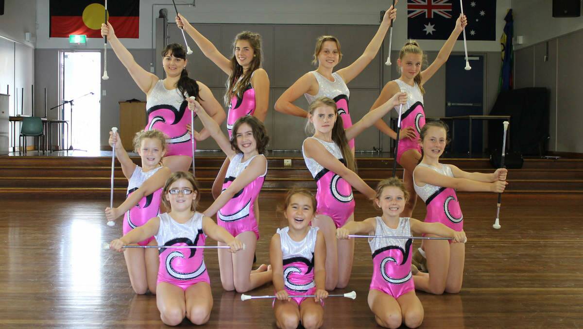 ROD RHYTHM: Some of the Rising Starz Baton Twirlers strike a pose in their colourful outfits during training.
