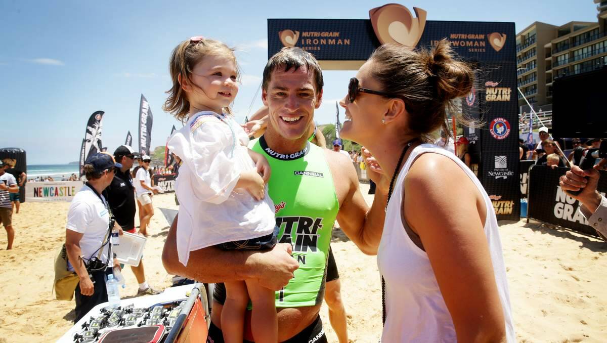 TOP EFFORT DADDY: Fifth-round winner Shannon Eckstein, from the Gold Coast, celebrates with wife Belinda and daughter Ellie after crossing the finish line.