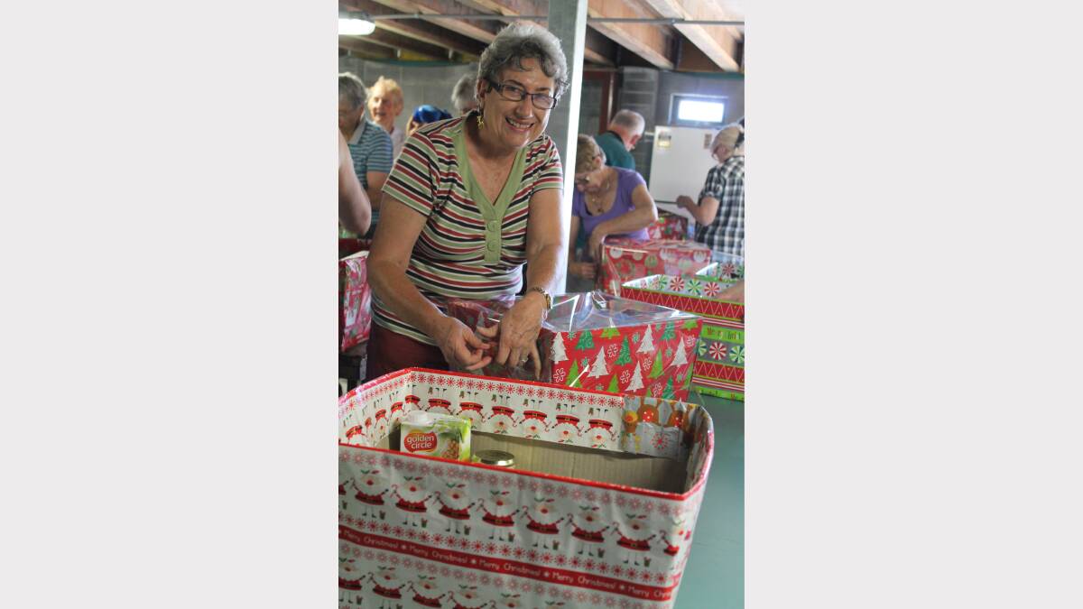 HELPERS: St Luke’s Uniting Church Community Commission volunteers pack hampers to distribute for Project Blessing. Volunteer Claire Brock, of Valentine.