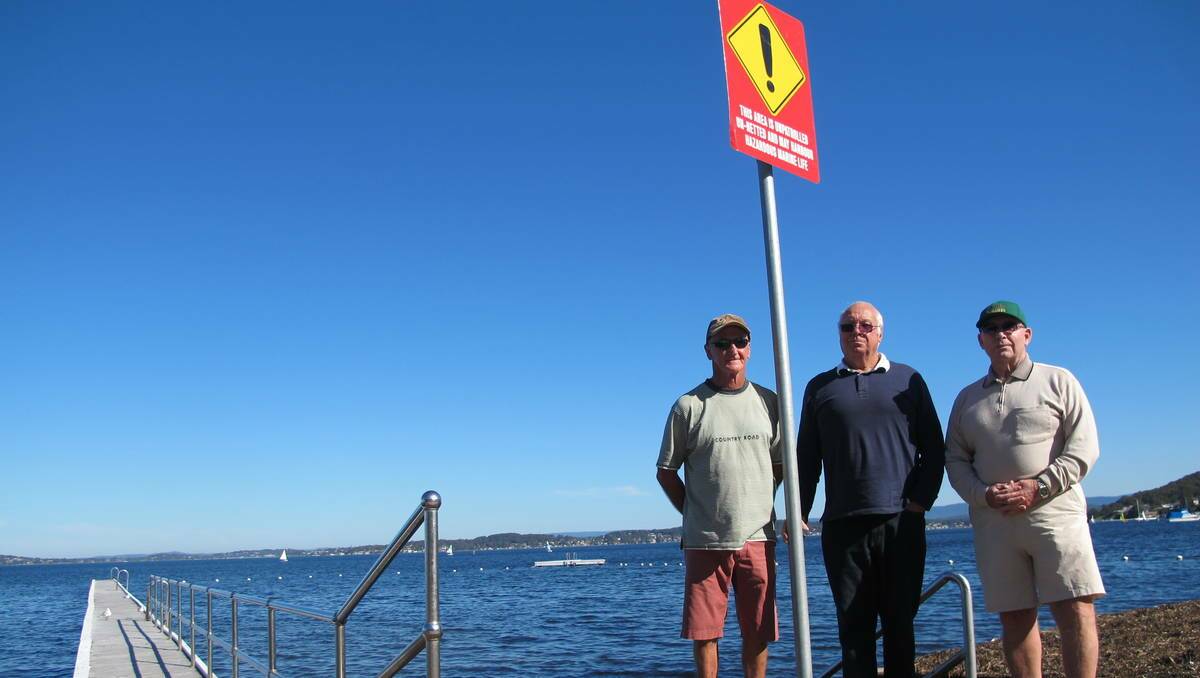 IGNORED: Ross Blatchford, Glyn Matthews and Doug Genders instigated a petition to install shark nets in Belmont baths. More than 1100 residents signed the petition but the council dismissed the call. 