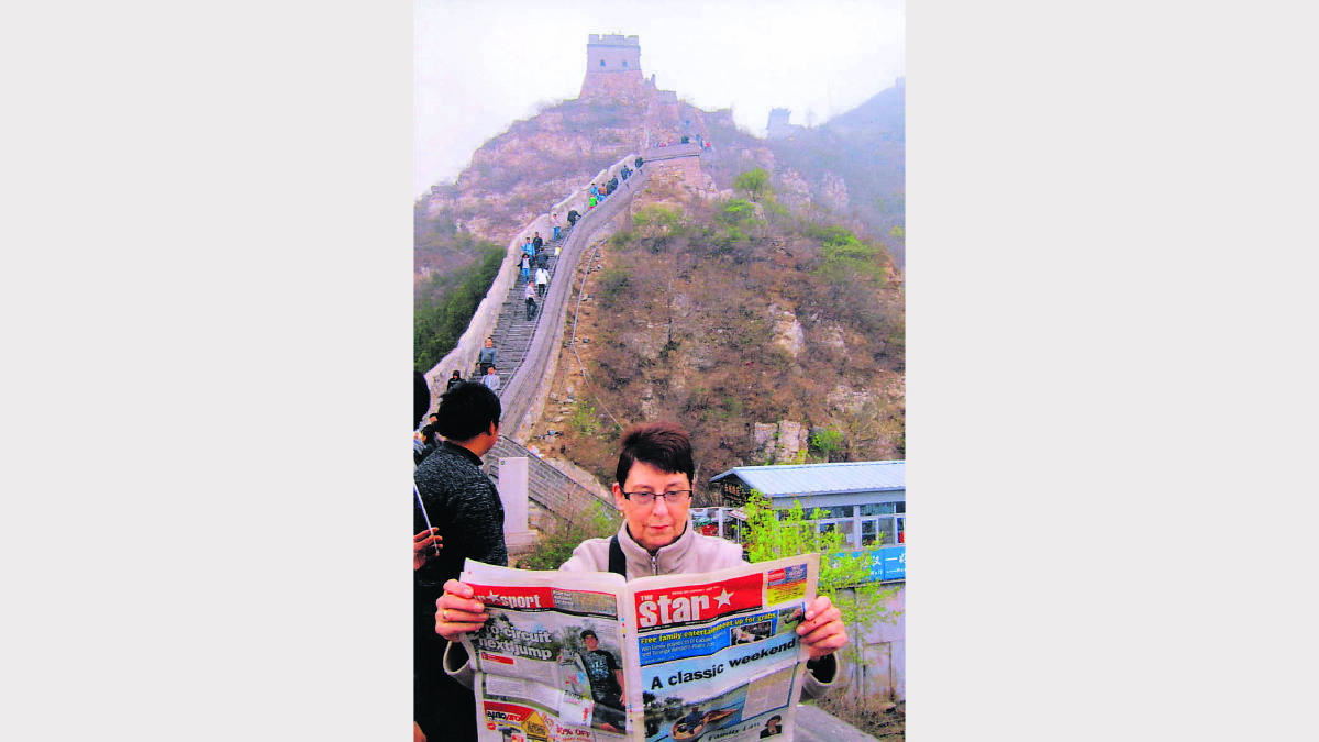 Last year's winning shot was winner Helen Jones of Wallsend reading The Star at the Great Wall of China.