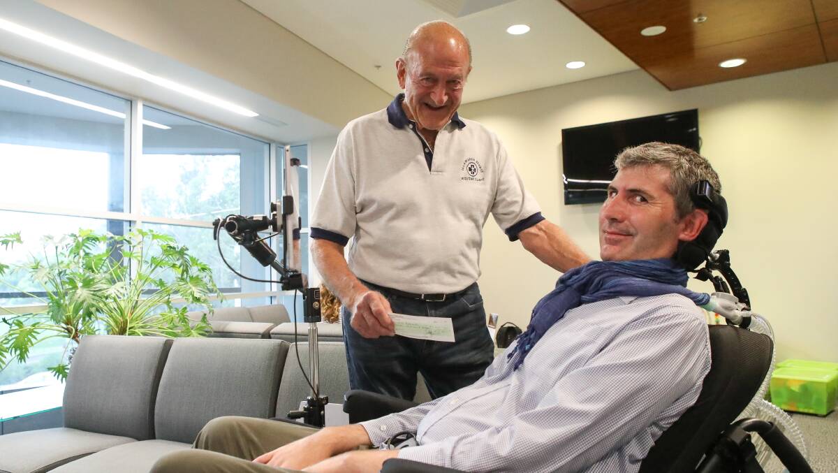 Professor Justin Yerbury with doctor Roger Parrish who donated $7000 from The Sports Medicine Clinic to Prof Yerbury's MND research earlier this month. Picture: Adam McLean