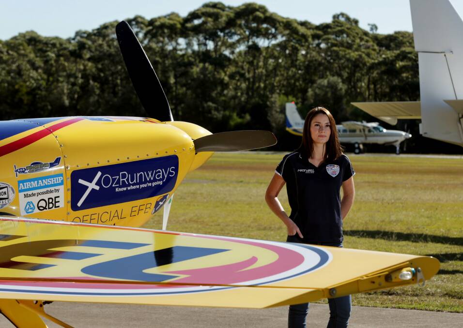 On a mission: Pilot Kate Sands works for Red Bull star pilot Matt Hall at his Belmont operation centre. One day she may be a Red Bull star, too. Picture: Simone De Peak