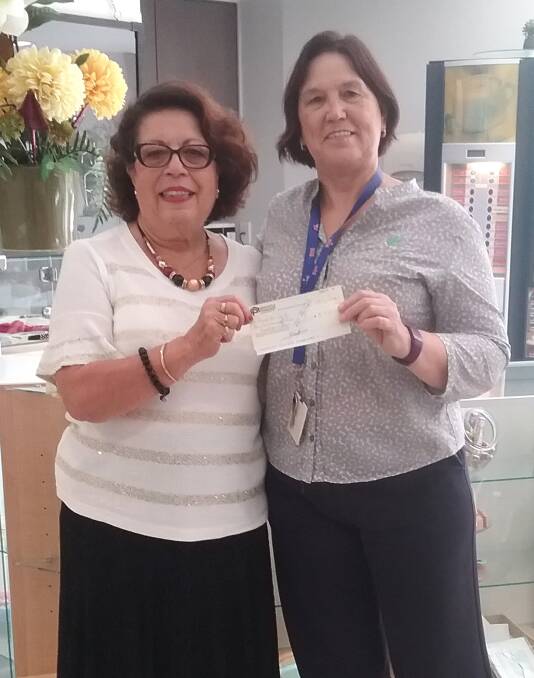 GENEROUS: Anna Marendy, President of Hippocrates, donates $5300 to Fronditha Care’s Hippocrates Residential Care Manager, Judith Cornish.