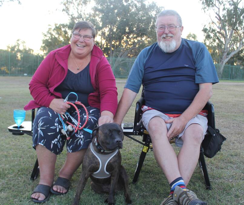 GREAT PLACE TO WAIT: Sharon and Derek Clements, from Nowra NSW, with their dog Archie, have been in Moree for a month, waiting for the Queensland border to reopen.