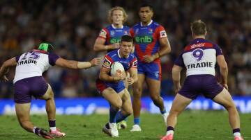 Newcastle Knights playmaker Jack Cogger eyes a gap against Melbourne. Picture by Peter Lorimer