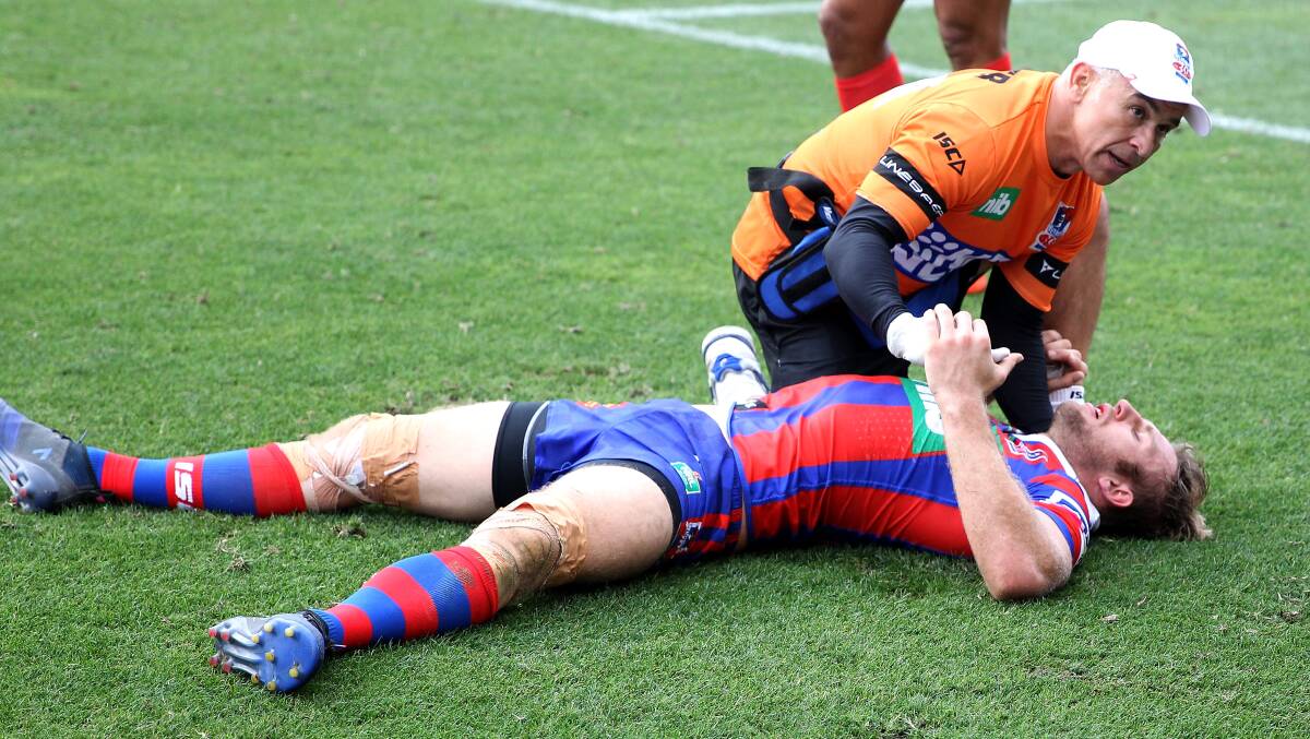 FLASHBACK: Knights fullback Brendan Elliot stays down for treatment during the loss to South Sydney on March 18. Picture: Getty Images