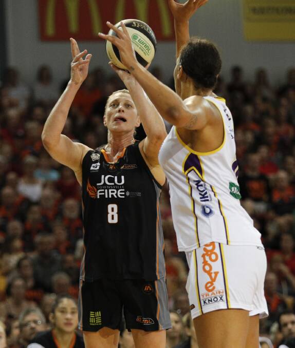 CLASH OF THE TITANS: Suzy Batkovic takes a shot on Sunday night despite the defence of Liz Cambage. Picture: AAP
