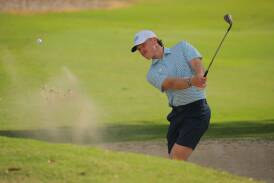 Jye Pickin blasts a shot out of the bunker during the interstate series at Southport Golf club on Monday. Picture by Dave Tease, Golf NSW