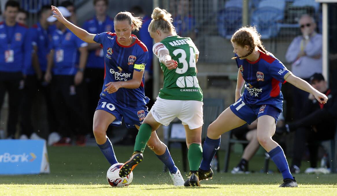 Emily Van Egmond, left, playing against Canberra. Picture: AAP