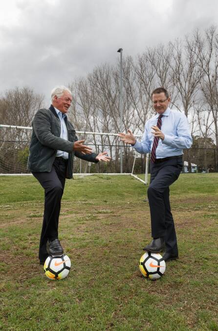 PLAY ON: Northern NSW Football chairman Bill Walker and NSW parliamentary secretary for the Hunter Scot MacDonald at Lake Macquarie Regional Football Facility on Thursday. Picture: Max Mason-Hubers 