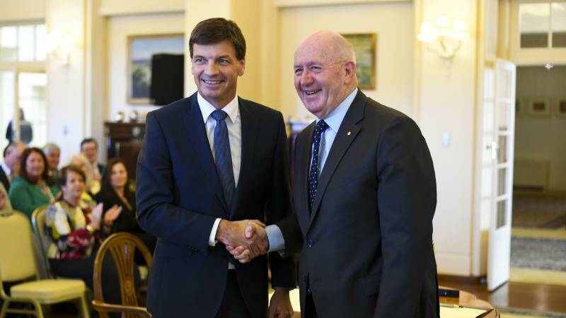 Angus Taylor MP (left) shakes hands with Australian Governor-General Sir Peter Cosgrove after being sworn-in as Australian Energy Minister. Photo: AAP Image/Lukas Coch