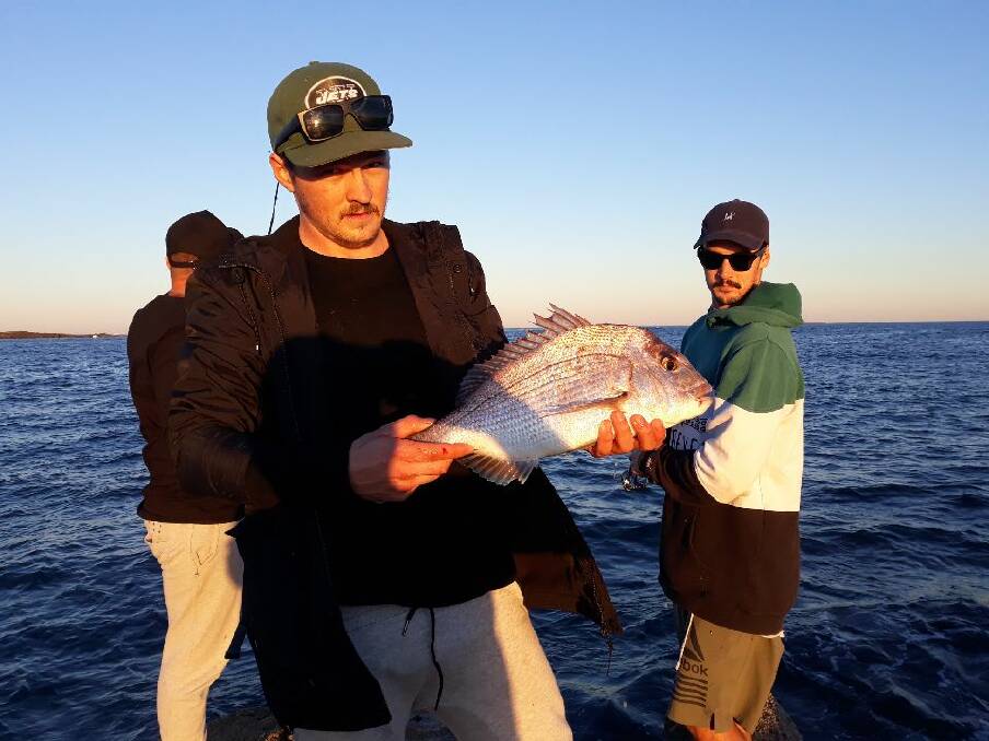 TOP CATCH: Damon Gerber and friends from Central Coast with nice snapper off rocks at Swansea.