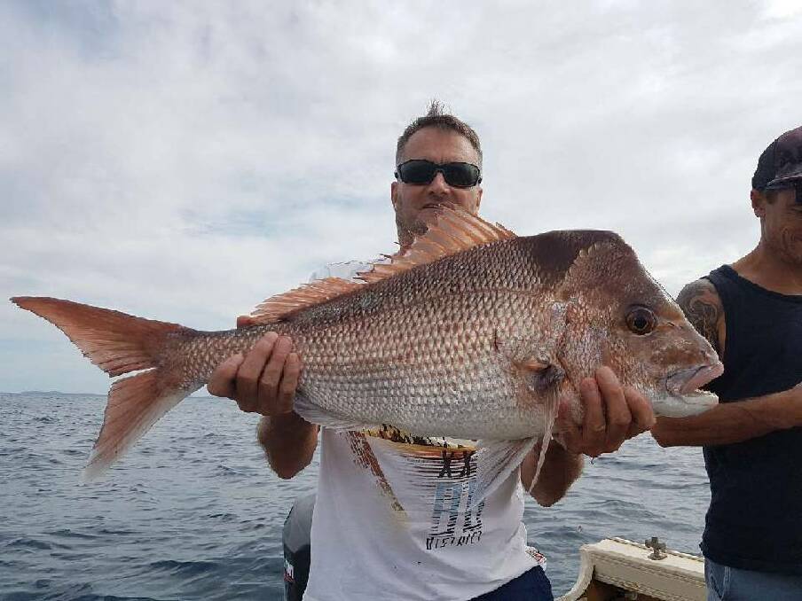 CATCH AND RELEASE: Peter Judd with awesome Broughton Island snapper prior to release.