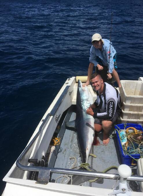 TOP CATCH: Josh Walkem and Thomas Mark, 13, with a 120kg Mako Shark.