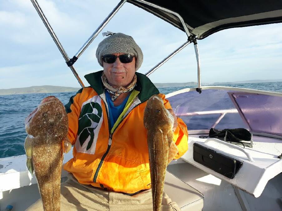 SOLID EFFORT: Tich McLealland with nice marbled flathead and sand flathead.