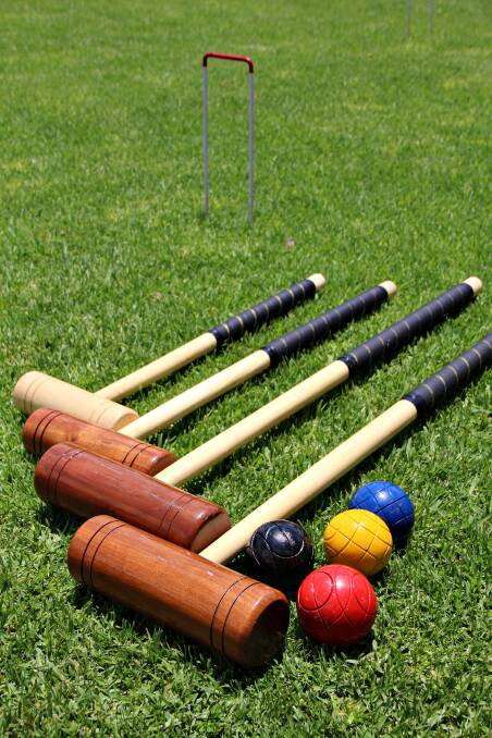 HAVE A GO: Golf croquet is at Pelican's Aitcheson Reserve on Friday.
