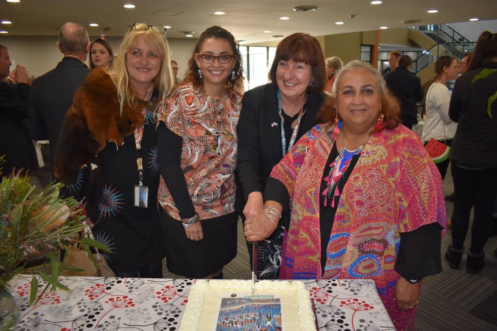 Cutting the Naidoc cake: From left:  Maree Edwards, Shanene Hornery, Cr Kay Fraser and Aunty Anne Pearce.