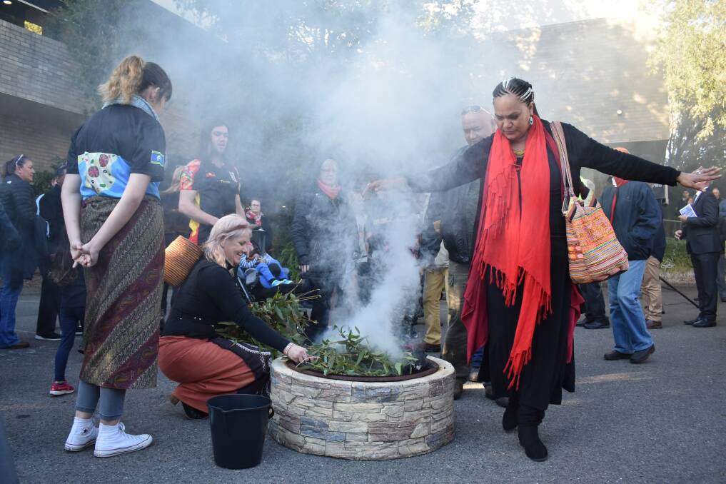 FOCAL POINT: A Smoking Ceremony outside the council chambers is a key part of NAIDOC week in Lake Mac.