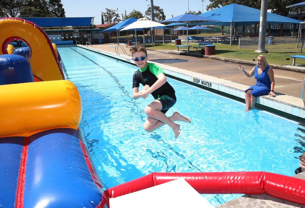 GREAT FUN: A new giant inflatable at Beresfield Swimming Centre is already proving popular.